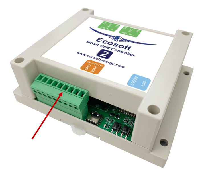 A white electronic device with a green and blue label
Description automatically generated